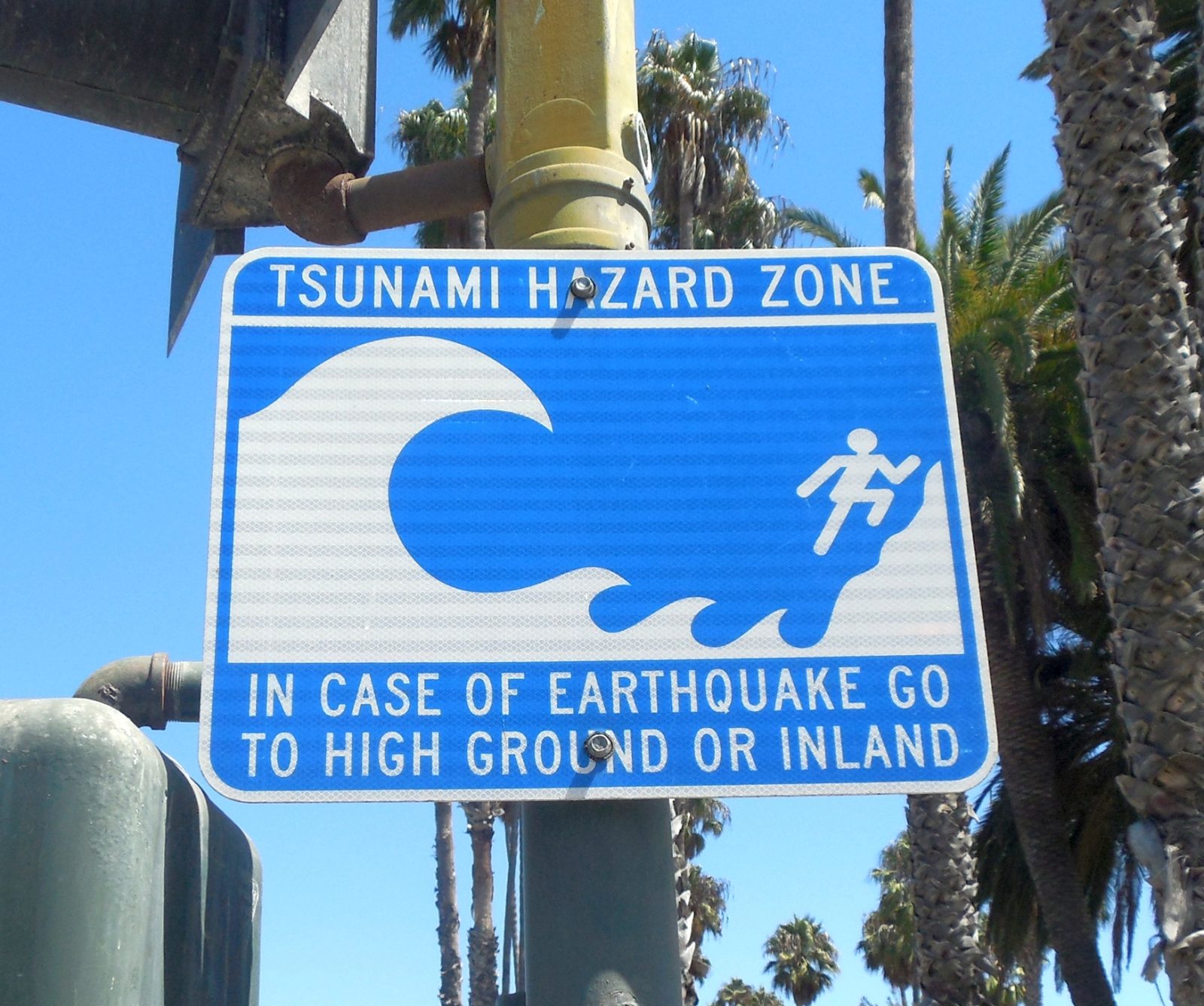 Blue 'Leaving Tsunami Hazard Zone' road sign in Santa Barbara, California