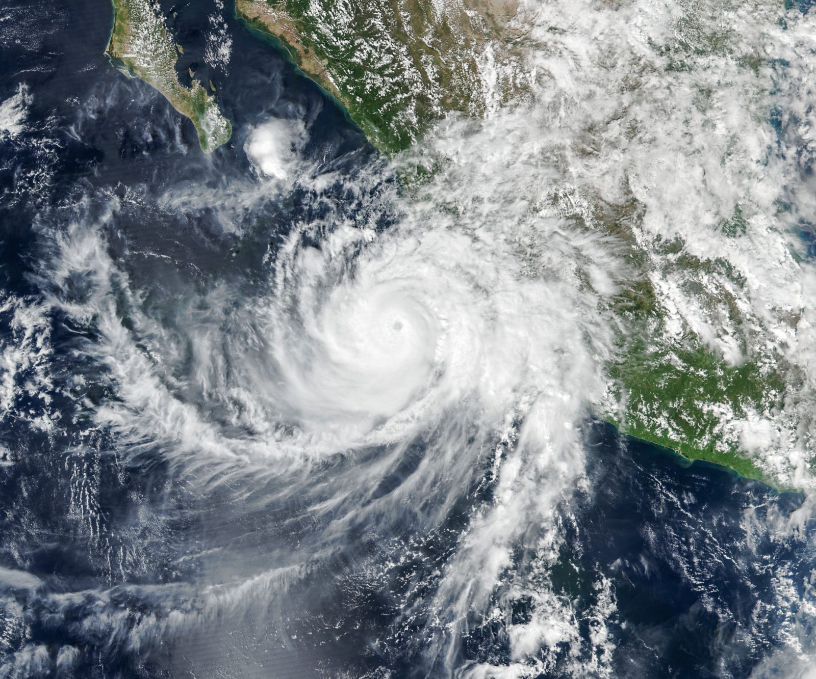 Satellite image of Hurricane Simon's well-defined eye just off Mexico's Pacific coast on 11 October 2026, captured near its Category 4 peak