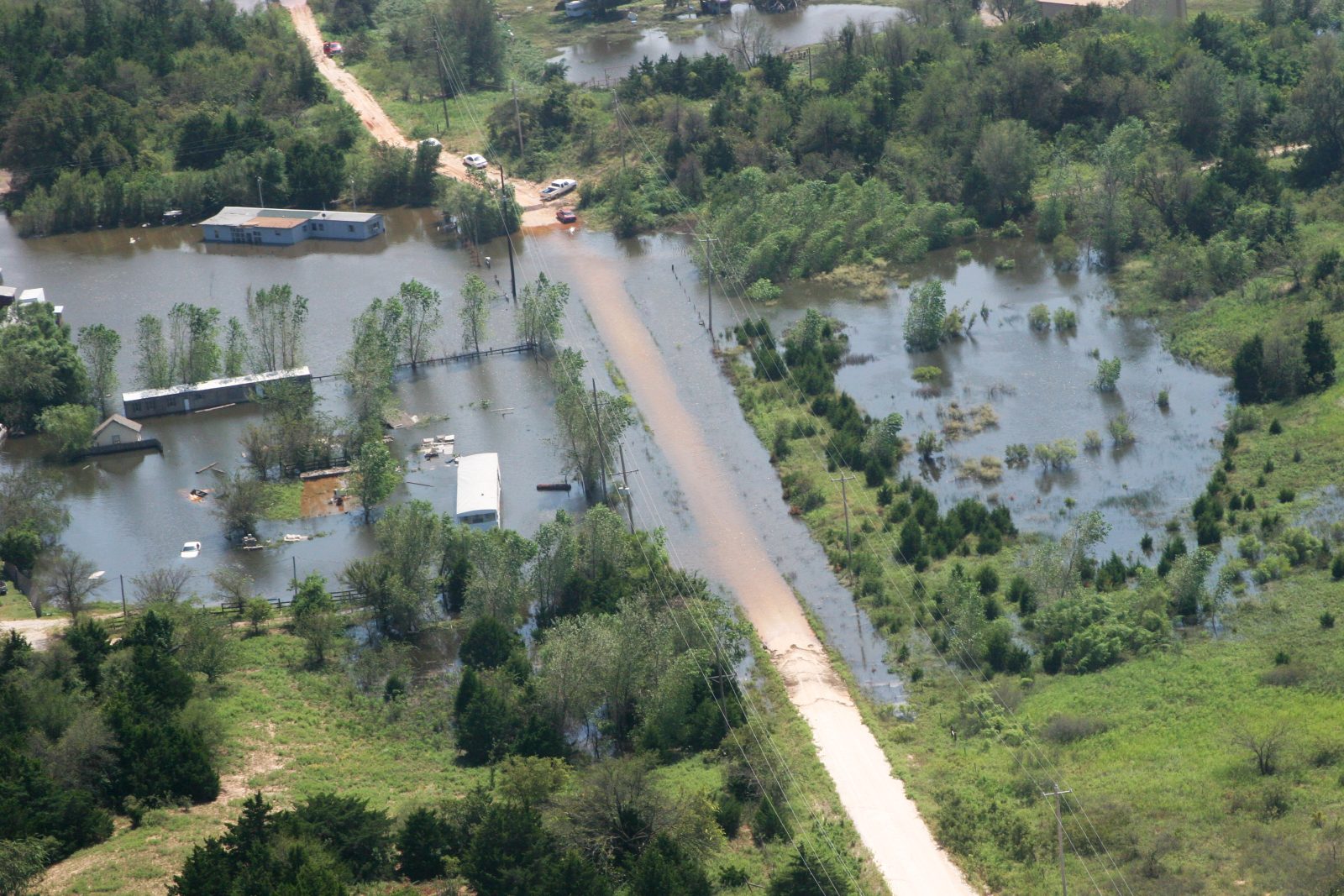 Cars turning around on a road flooded after Tropical Storm Erin in Grady County, Oklahoma